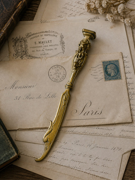 Elegant antique letter opener with monogram seal